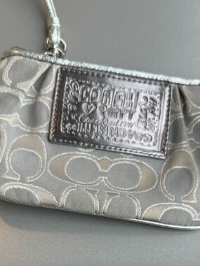 Coach Poppy Metallic Silver Signature Wristlet –